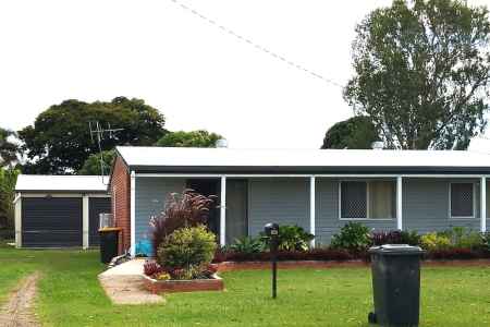 3 Bedroom low set home on flood free property across from Parkland with 4 bay shed