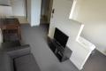 Stylish Furnished Apartment with Pool View – Walk to Uni & Lygon Street