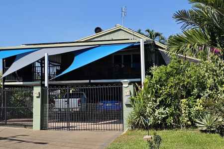 Beautiful 4-bedroom elevated house with lush tropical gardens and large solar heated pool