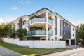 Contemporary Top Floor Apartment in a Boutique Complex!