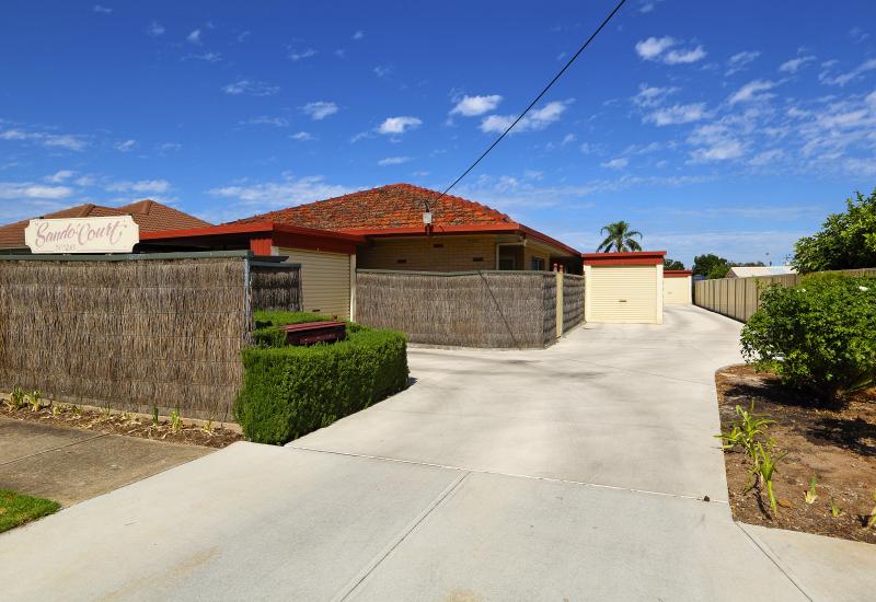 Superbly located in a small group with private front & rear courtyards