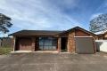 Freshly Painted Family Home with 3 Air Conditioners & Flexible Living Options!