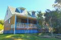 Magnificent water views from your front deck! Rustic Island Home.