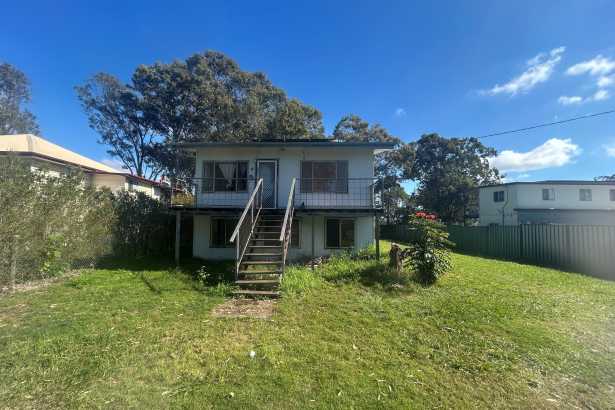 Diamond in the Rough with Water Views & Room to Grow