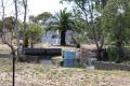 Pyramid house with acreage and dam
