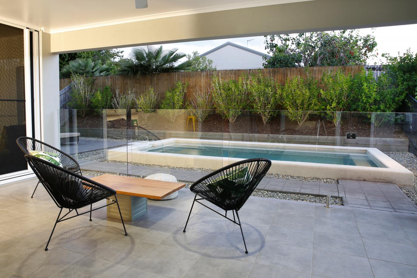 A tiled patio connecting living, kitchen and alfresco dining