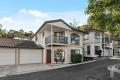 Leafy Outlooks and Resort Amenities in a Gated Estate