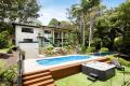 Sun-Soaked Serenity on 1.6 Acres – The Ultimate Entertainer with Dual Living and Designer Finishes