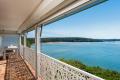 Absolute Waterfront Home with Rainforest Gardens, Panoramic Views & Direct Beach Access