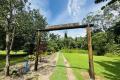 Solid Home on 5 Acres with 2 Sheds, Pool and a Creek !