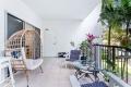 Stylish City-Fringe Apartment with Poolside Living