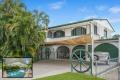 Tropical Retreat with Poolside Paradise – Meticulously Maintained - First Time on the Market Since 1979!