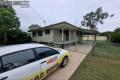 Tidy 3 bedroom home with under cover entertainment & storage.