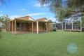 Four-bedroom home situated in the heart of Windaroo Lakes Golf Course