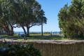Spacious Ground Floor Coastal Retreat with Ocean Views & Garden Serenity